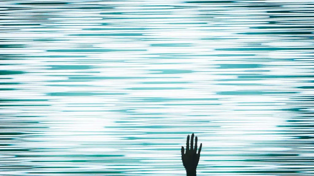 image of a blue and white wavy background with a shadow of a hand raised above the lower margin